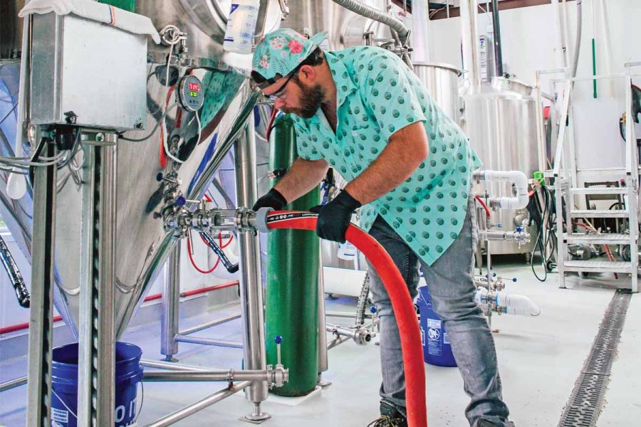 Brewer in colorful shirt in brewhouse