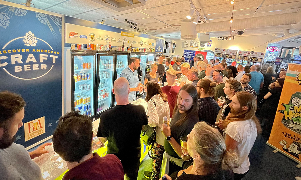 Craft beer enthusiasts at American craft beer booth in Stockholm