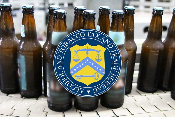 beer bottles with blurred labels and ttb logo