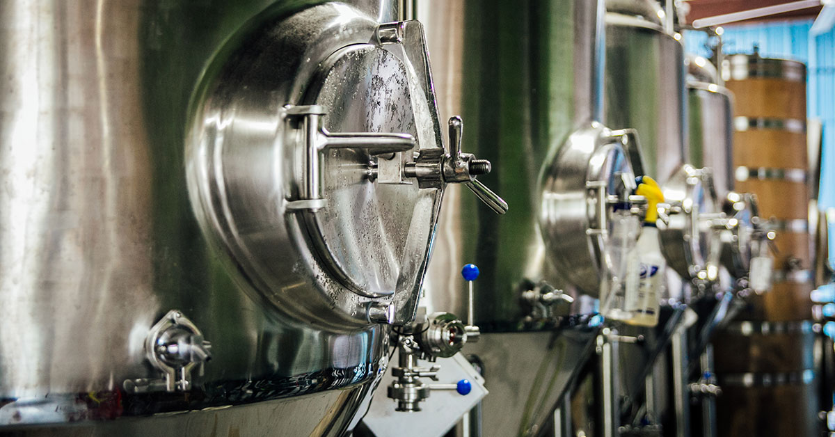 fermenters lined up in brewhouse x