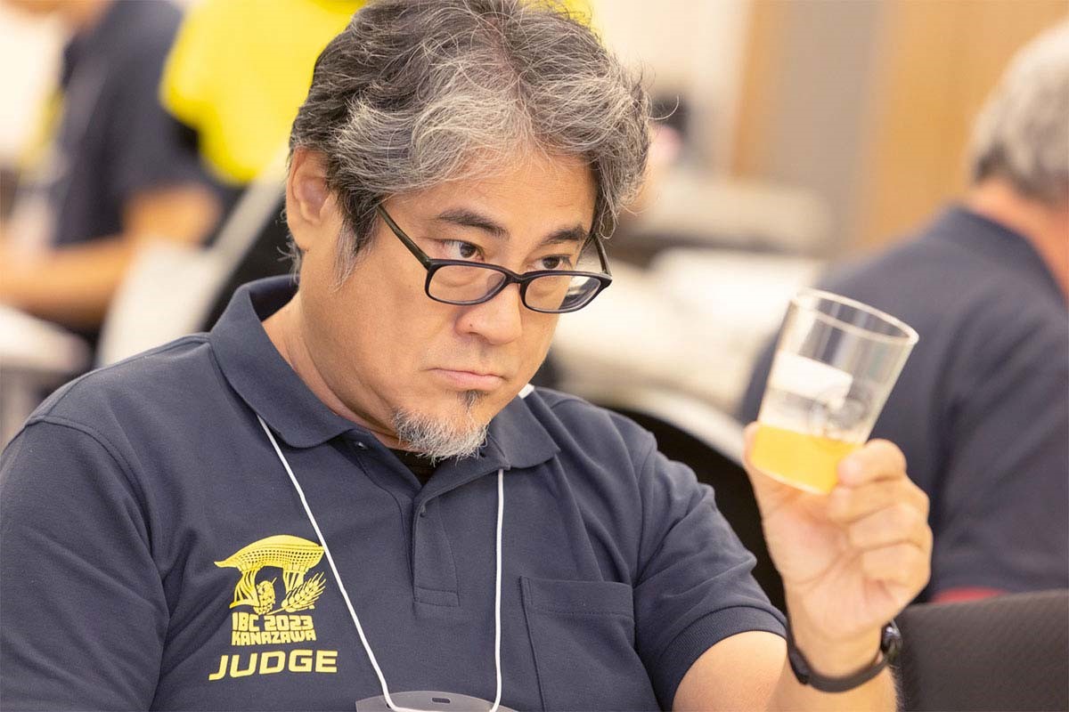 man judging beer