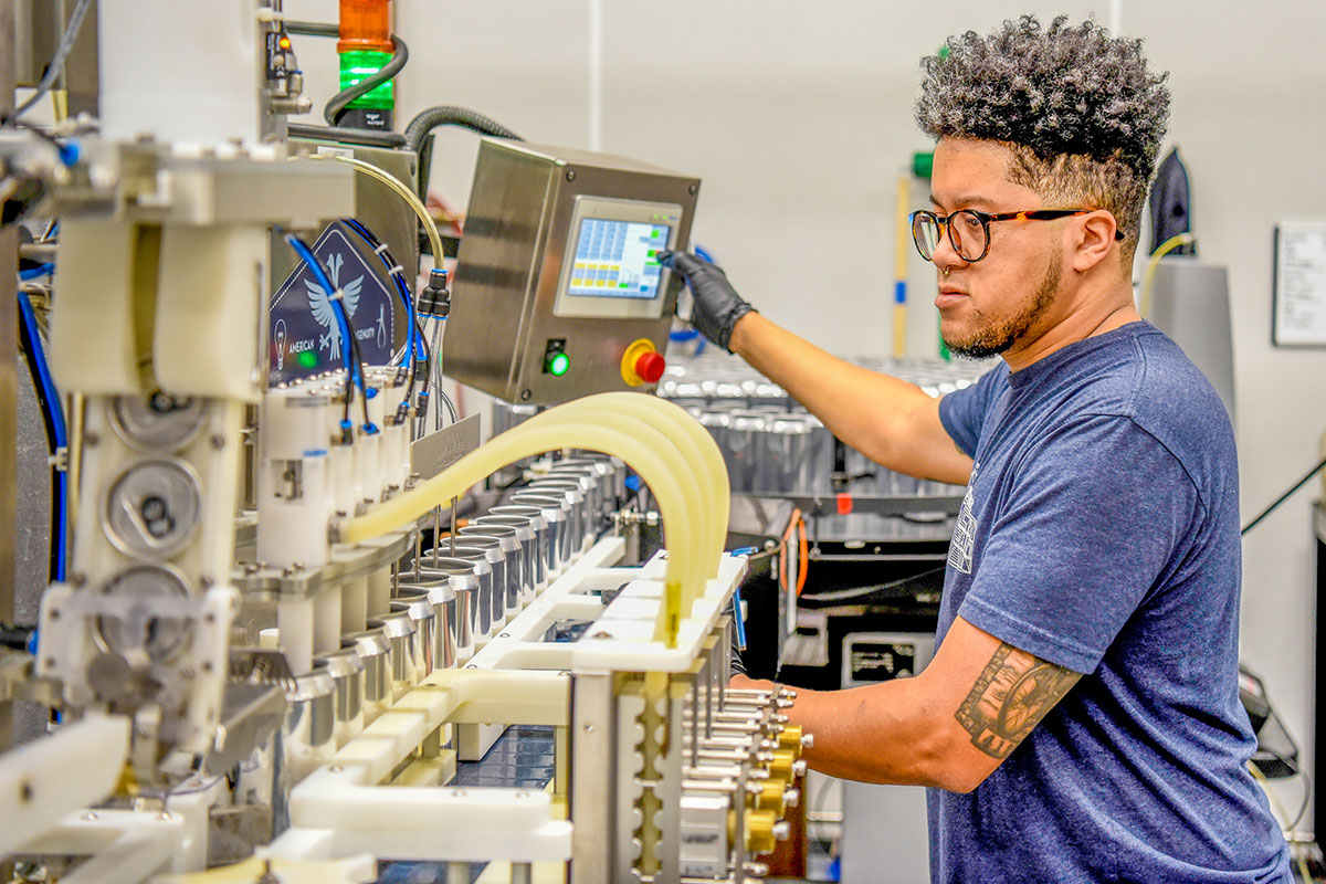 Man operating canning line