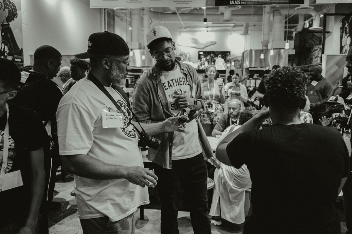 man pouring beer at black is beautiful beer event