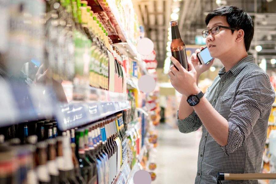 selecting beer in retail store 1200x628 1