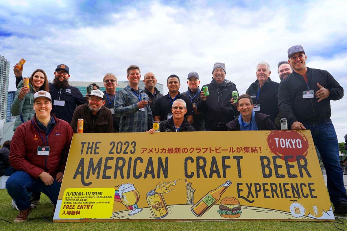 tokyo american craft beer experience attendees holding sign