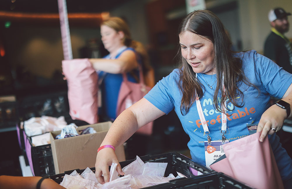 woman packing up hygeine kits as part of Thrive service project